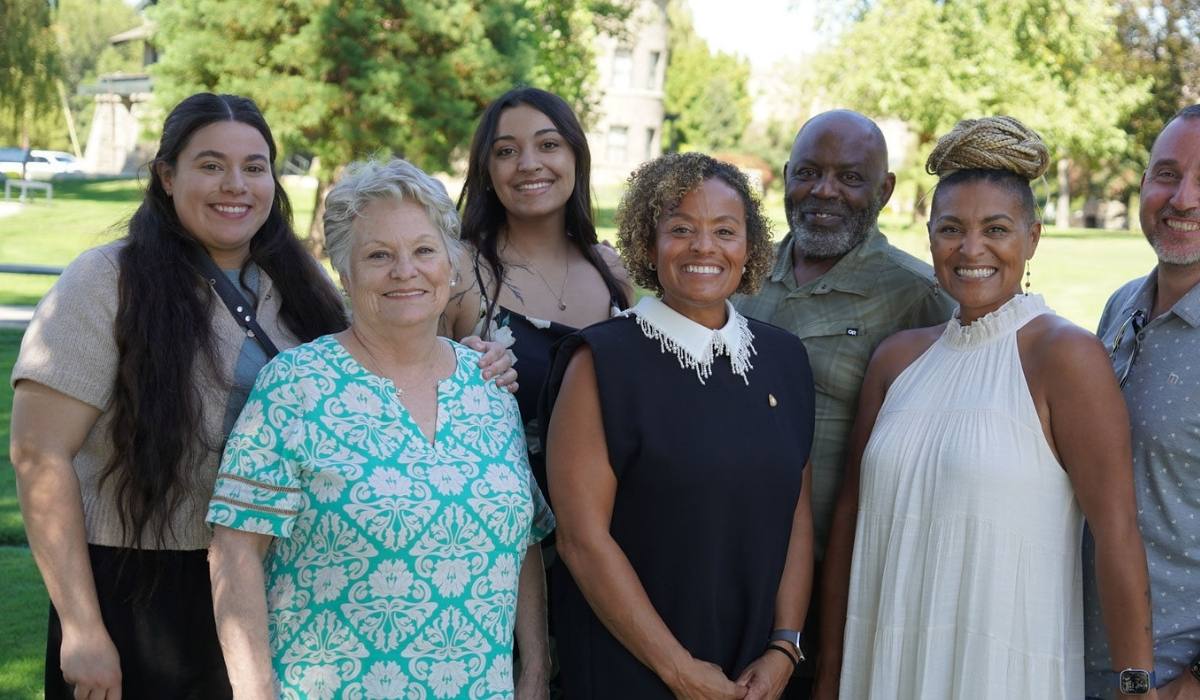 RN to BSN graduates posing outside on campus