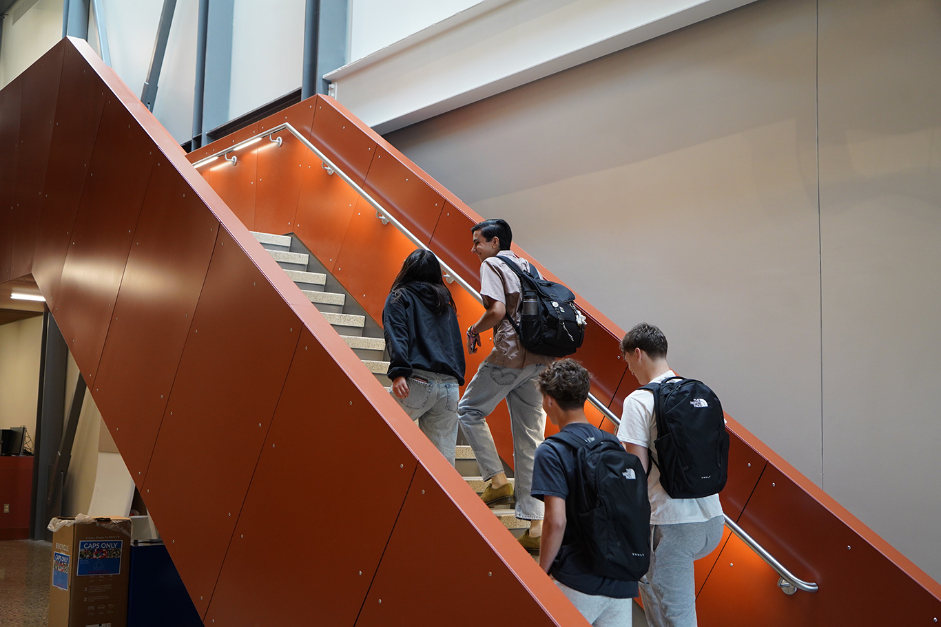 Students walking to class in Mish ee twie building