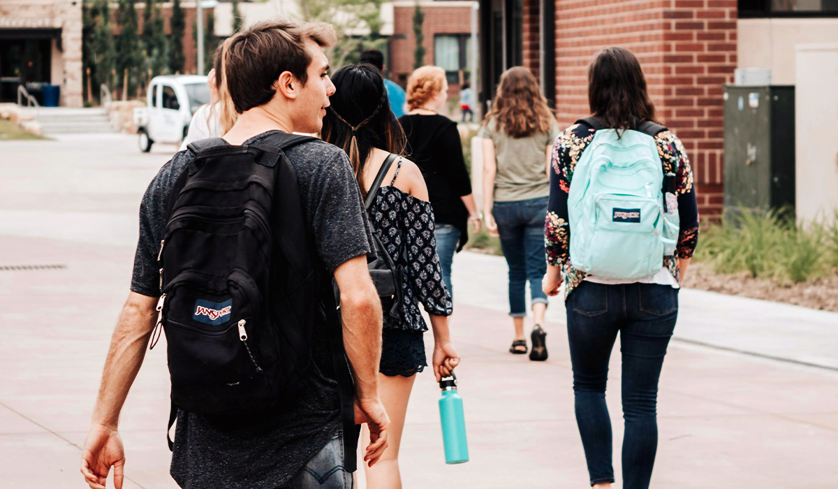 A group of students walking across campus.