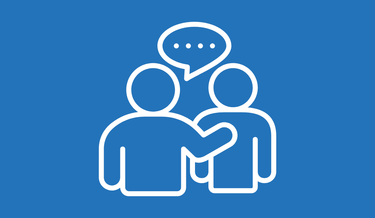 A white icon of two people speaking against a blue background.