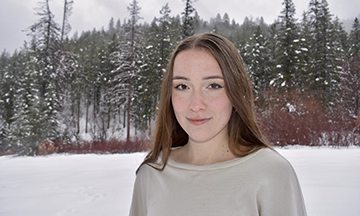 Portrait of Madelyn Schwilke outside in winter landscape.